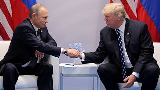 FILE PHOTO: President Trump shakes hands with President Putin in July