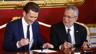 Austria's president swears in new coalition government 