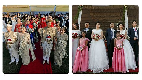Couples pose for photographs during a mass wedding ceremony