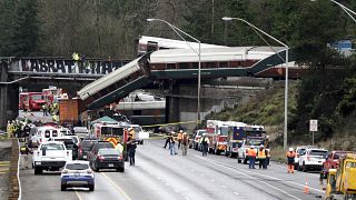 Three die as speeding train derails on highway bridge in Washington state