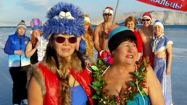 Russians bathe in freezing water to support National Olympics team Russians bathe in freezing water to support National Olympics team