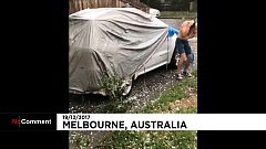 A man seeks shelter from "golf-ball" sized hailstones in Australia
