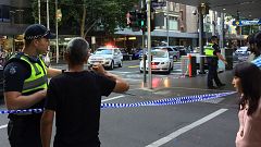 Police officers stand guard after arrest of the driver Melbourne