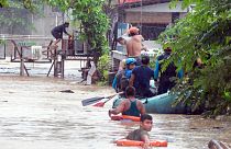 Rescuers evacute residents during heavy floodingin  Philippines