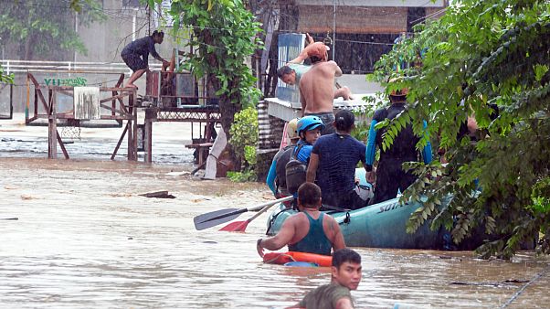 Rescuers evacute residents during heavy floodingin Philippines Rescuers evacute residents during heavy floodingin Philippines