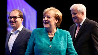 Angela Merkel accompanied by Alexander Dobrindt of CSU