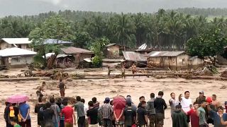 Philippine storm: Death toll of 200 expected to rise as rescuers search for victims