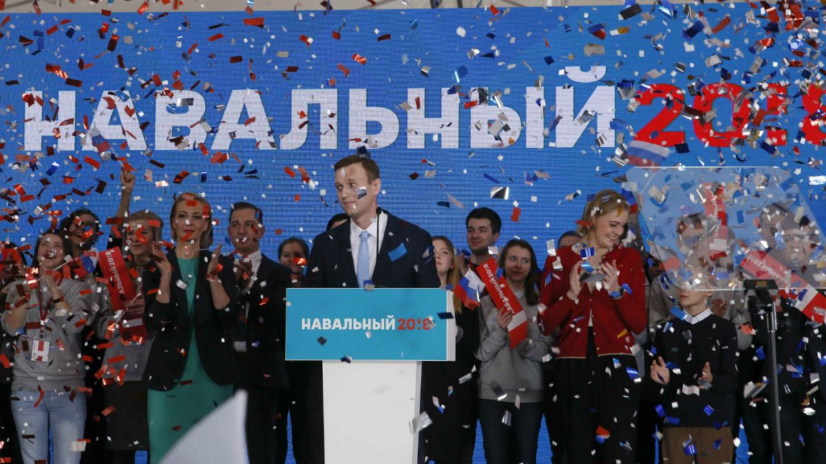 Alexei Navalny attends a meeting to uphold his bid for presidential candida