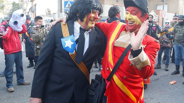 A reveller masked as former Catalonian President Carles Puigdemont A reveller masked as former Catalonian President Carles Puigdemont