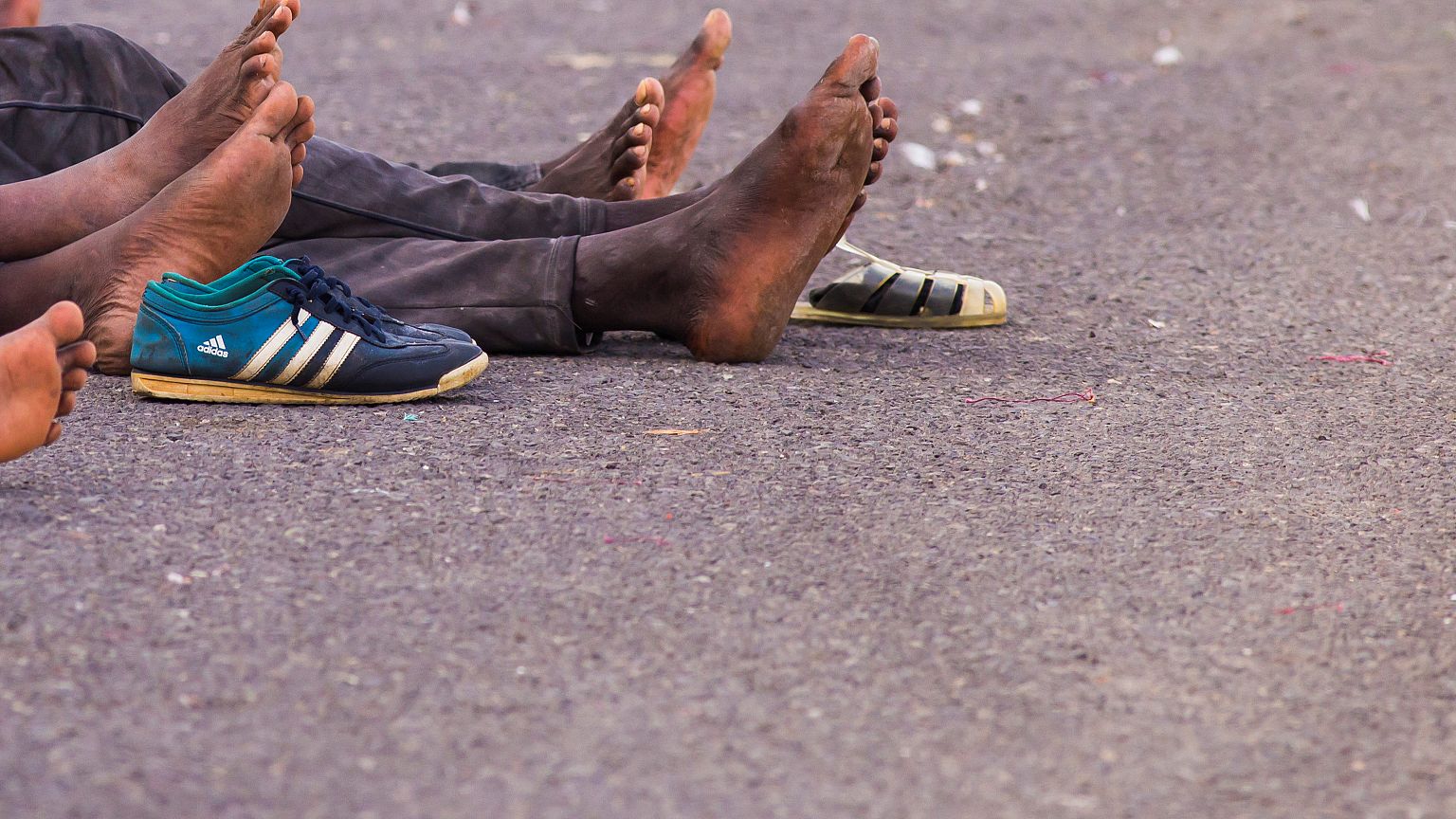 Migrants, who are part of a group intercepted aboard a dinghy off the coast