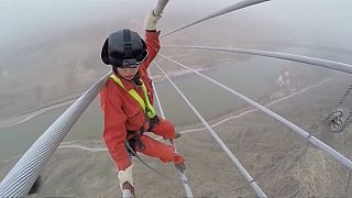 Workers make final checks on China's new power line