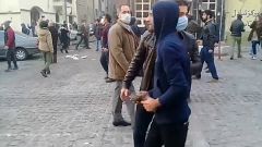 Protesters threw stones in clashes with riot police