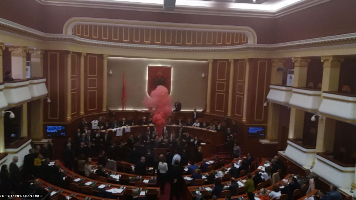 A smoke bomb erupts in Albania's parliament