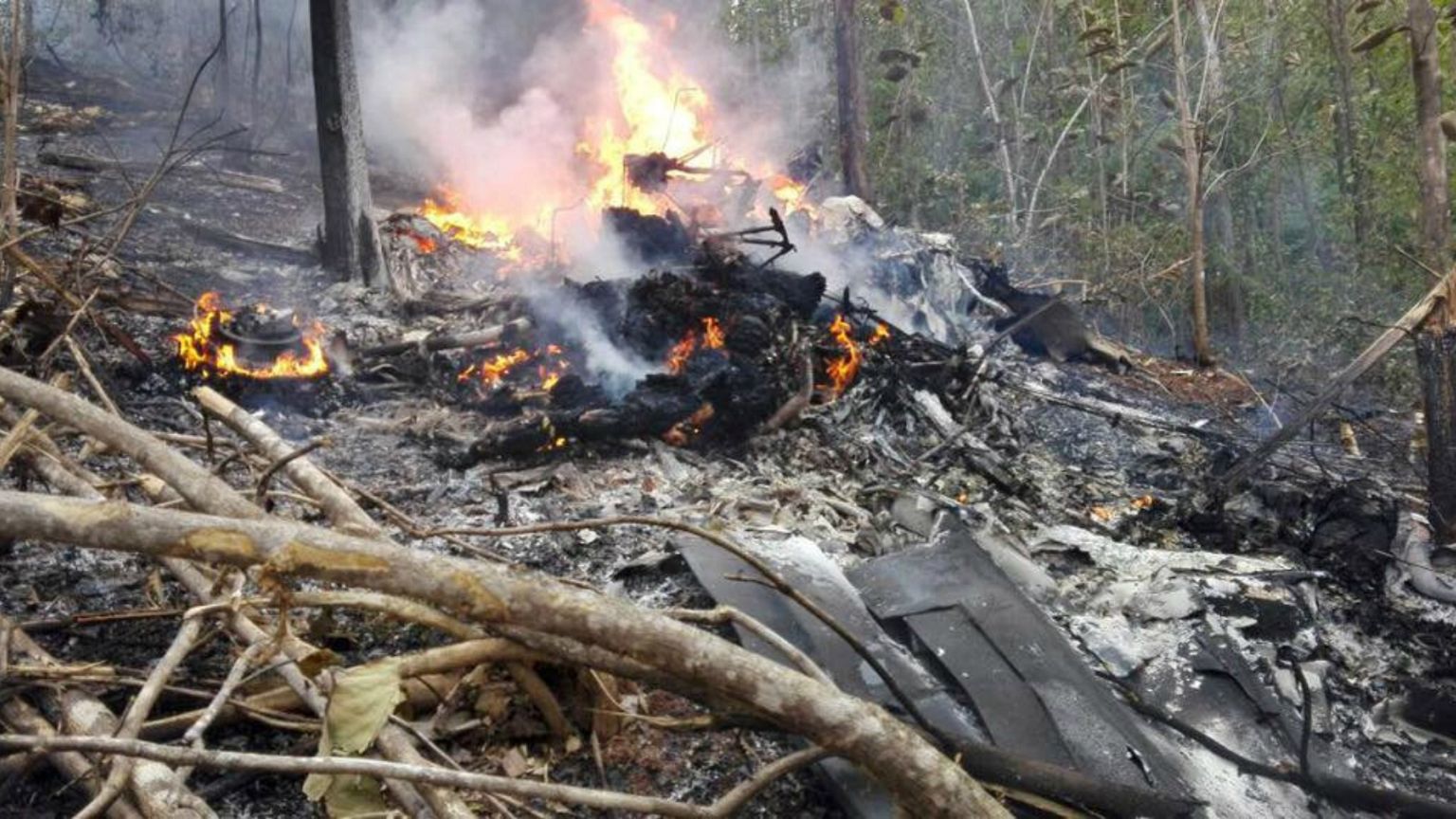 Smoke and fire seen at the site where a plane crashed 