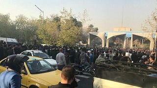 People protest near the university of Tehran