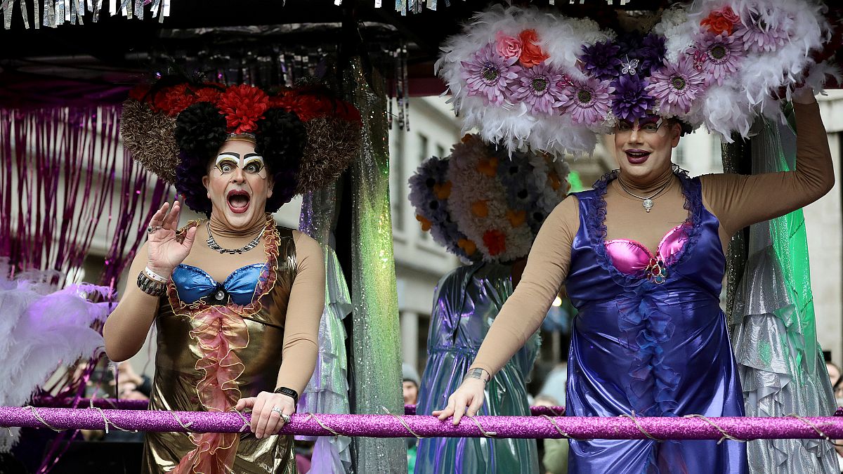 Performers wave to the crowd during the New Year's Day parade in London
