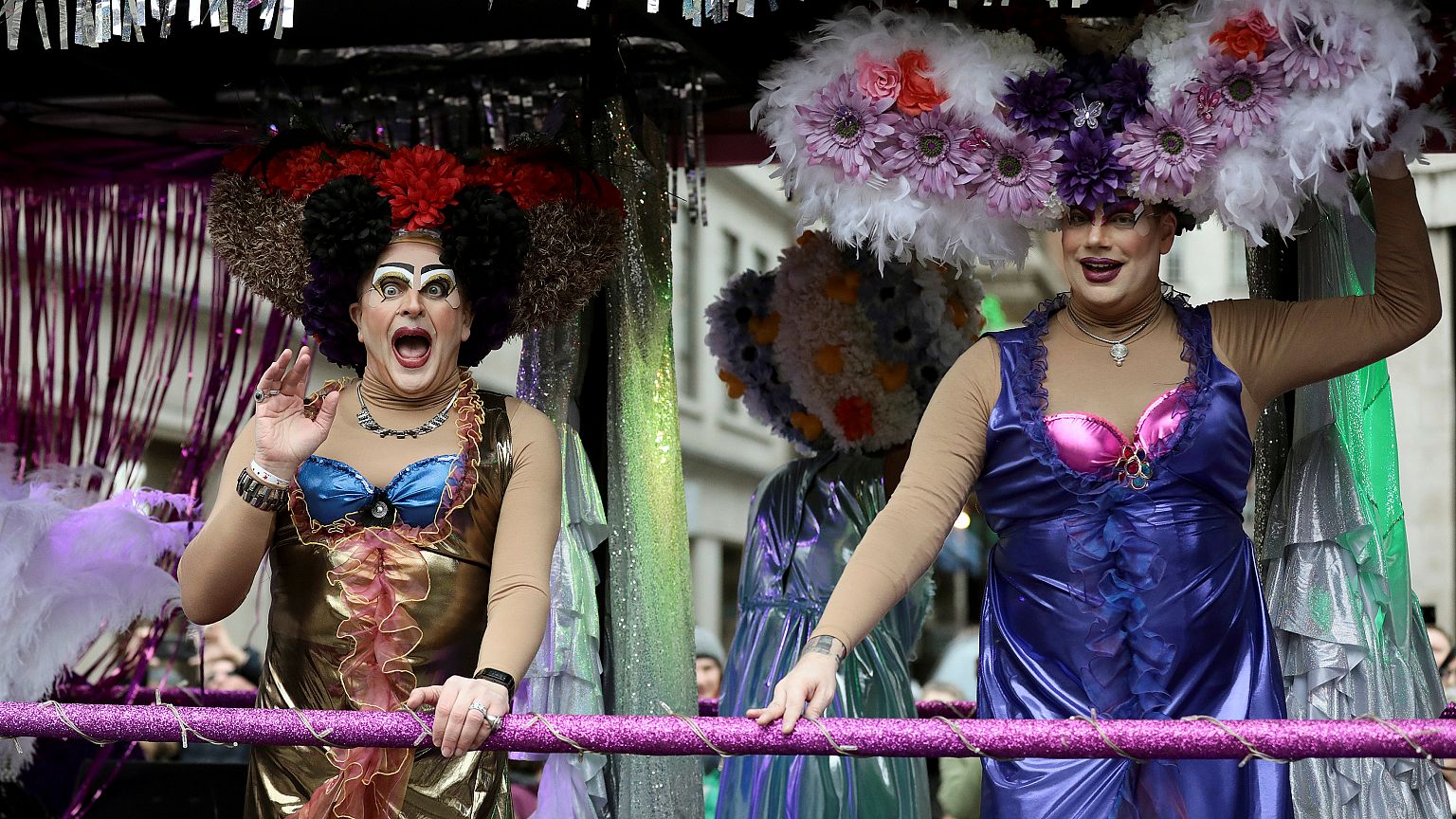 Performers wave to the crowd during the New Year's Day parade in London