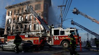 FDNY firemen work at an apartment building in the Bronx, New York, U.S.