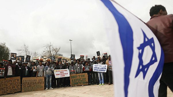 African migrants hold placard protest outside Israel Supreme Court African migrants hold placard protest outside Israel Supreme Court