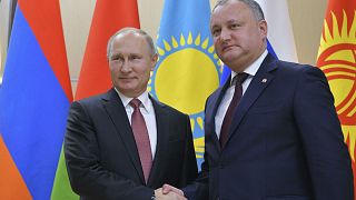 Moldovan President Igor Dodon shakes hands with his Russian counterpart