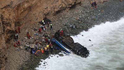 At least 48 are killed after a bus plunges off a cliff on a highway known as 'Devil's Curve' in Peru