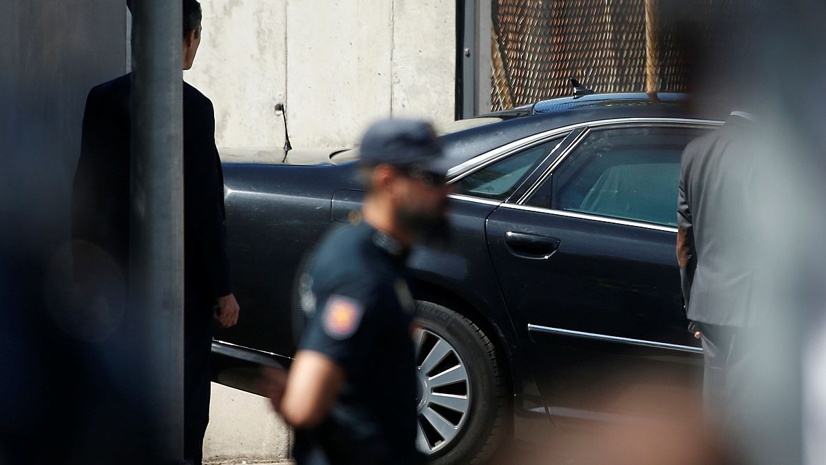 The car carrying Spain's PM Rajoy leaves the courthouse garage