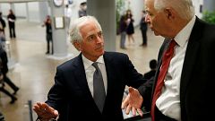 Senator Bob Corker speaks with Senator Ben Cardin 