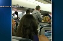 Passengers scramble to emergency exits