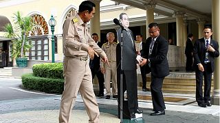 Thai PM leaves cardboard cutout of himself to answer journalists' questions