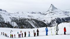 Helicopters airlift people from Swiss ski resort cut off by snow