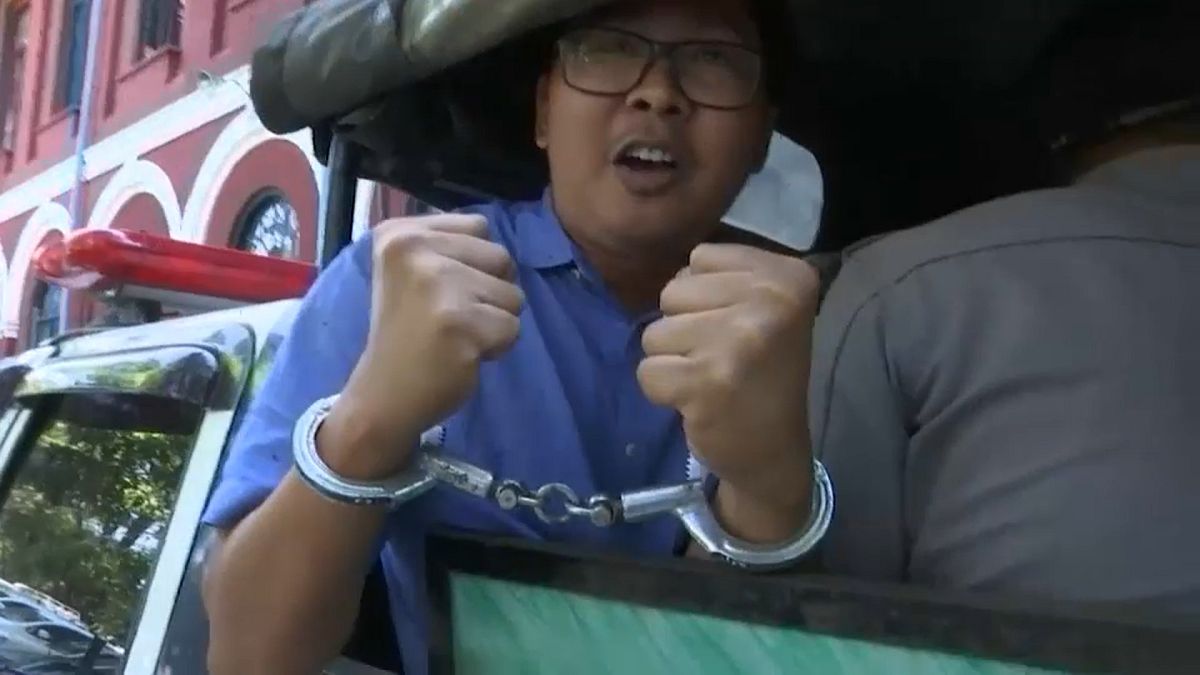 Reuters journalist Wa Lone on the way to court in handcuffs,