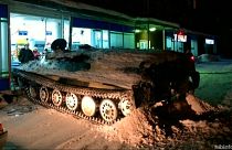 Russian man tries to beat closing time with tank