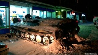 Russian man tries to beat closing time with tank