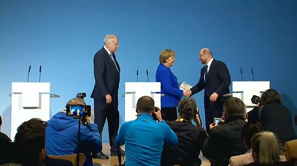 Merkel and Schulz shake hands Merkel and Schulz shake hands
