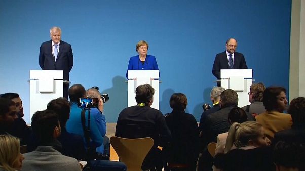 Merkel y Schulz llegan a un principio de acuerdo para otra gran coalición Merkel y Schulz llegan a un principio de acuerdo para otra gran coalición