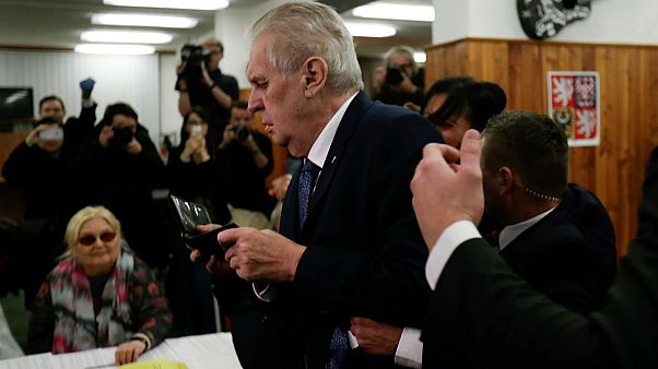 Czech President Milos Zeman arrives to cast a vote befor femen attack Czech President Milos Zeman arrives to cast a vote befor femen attack