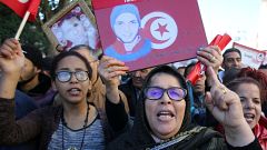People attend demonstrations on the seventh anniversary of revolution  