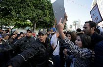 Tunisia Police and people react during demo the 7th anniversary