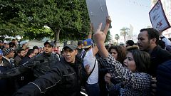 Tunisia Police and people react during demo the 7th anniversary 