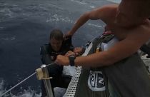 Sailor Alex Gough rescued by a shipmate after falling into the Pacific