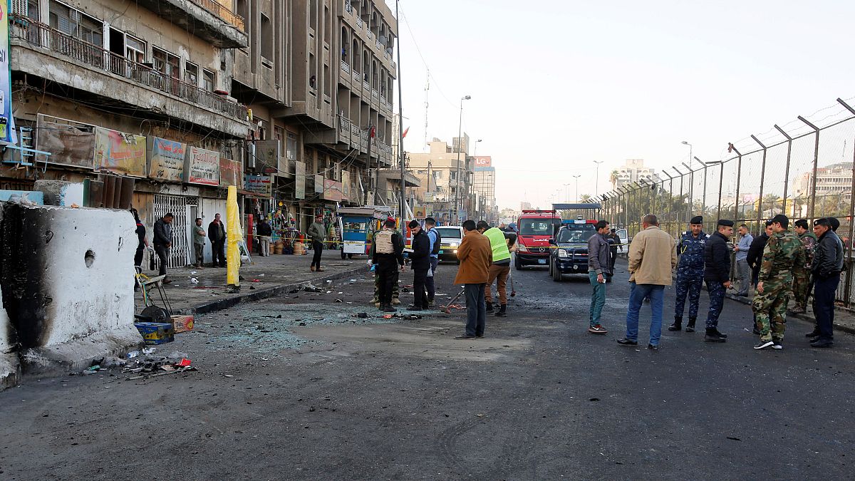 Iraq: dozens killed as suicide bombers hit Baghdad market 