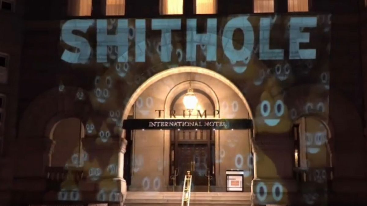 "Shithole" projected on Trump Hotel in D.C.