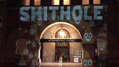 "Shithole" projected on Trump Hotel in D.C.