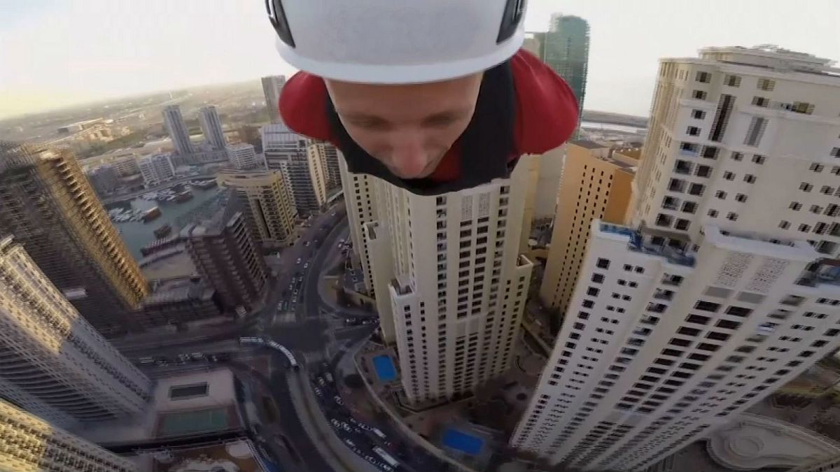 Daredevils ride the world's 'longest and fastest urban zip line'
