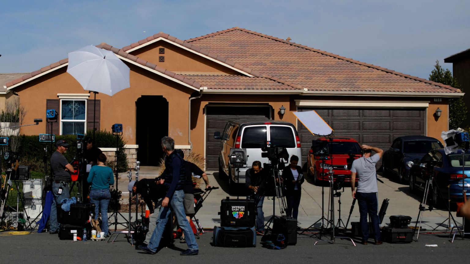 New media gather outside the home of David Allen
