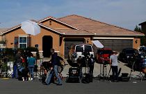 New media gather outside the home of David Allen
