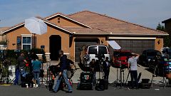 New media gather outside the home of David Allen