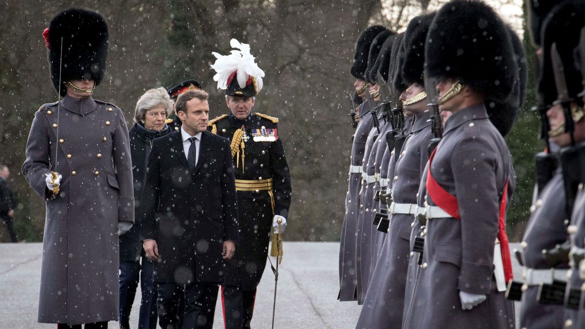 French President Emmanuel Macron inspects troops at Sandhurst