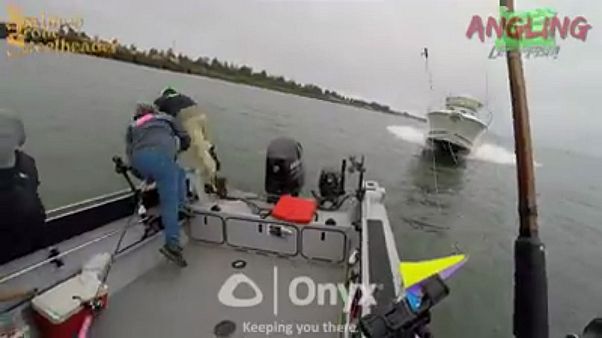 A still from the dramatic video of the fishermen's narrow escape A still from the dramatic video of the fishermen's narrow escape