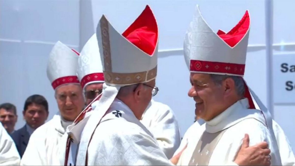 The Pope hugs Bishop Juan Barros during mass